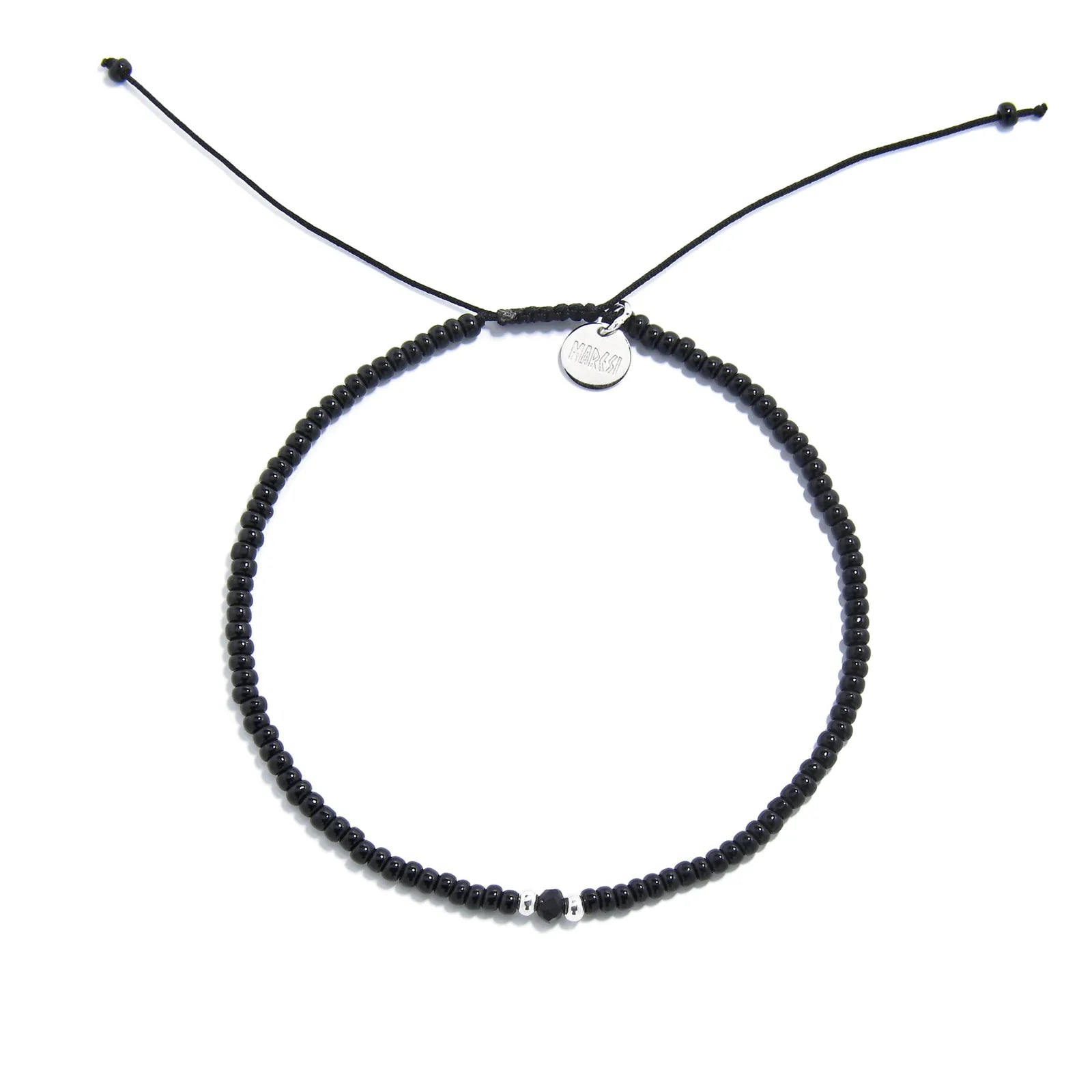 black crystal bracelet for men shown from above with black seed beads with dark faceted accents and round bracelet shape