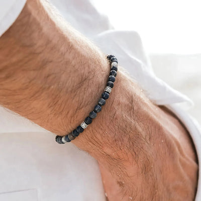 black jasper bracelet worn on wrist with black stone beads and metal accents