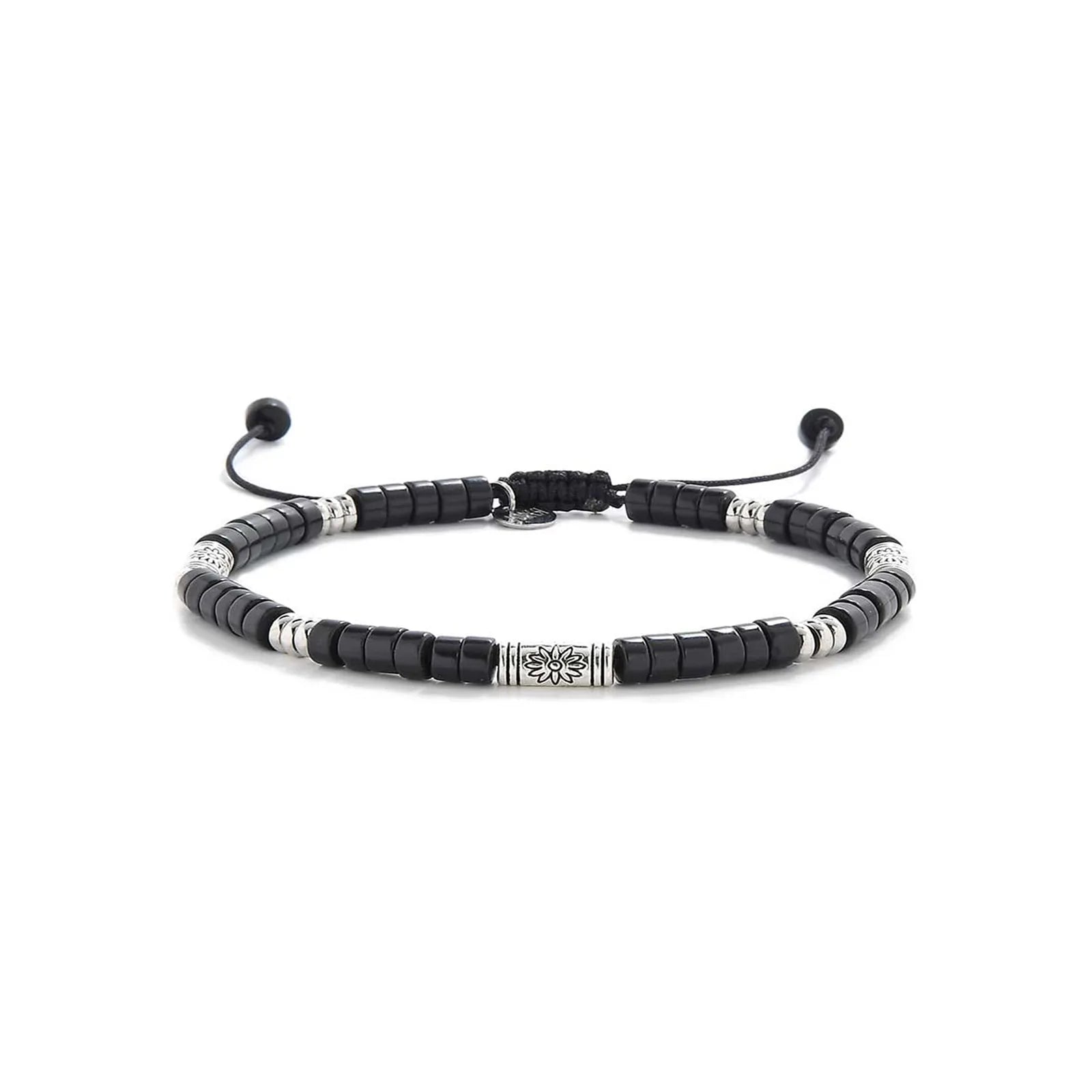 black shamballa bracelet shown in full view with black clay beads with engraved silver spacers and adjustable cord