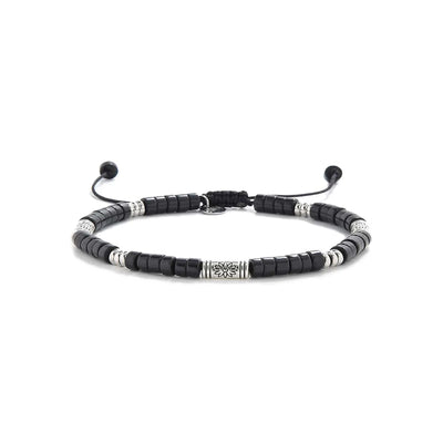black shamballa bracelet shown in full view with black clay beads with engraved silver spacers and adjustable cord