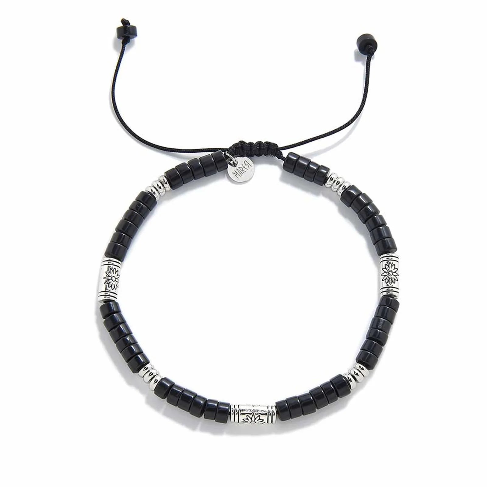 black shamballa bracelet shown from above with black clay beads with engraved silver spacers and round bracelet shape