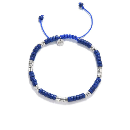 Blue Beads shown from above with blue clay beads with engraved silver spacers and round bracelet shape