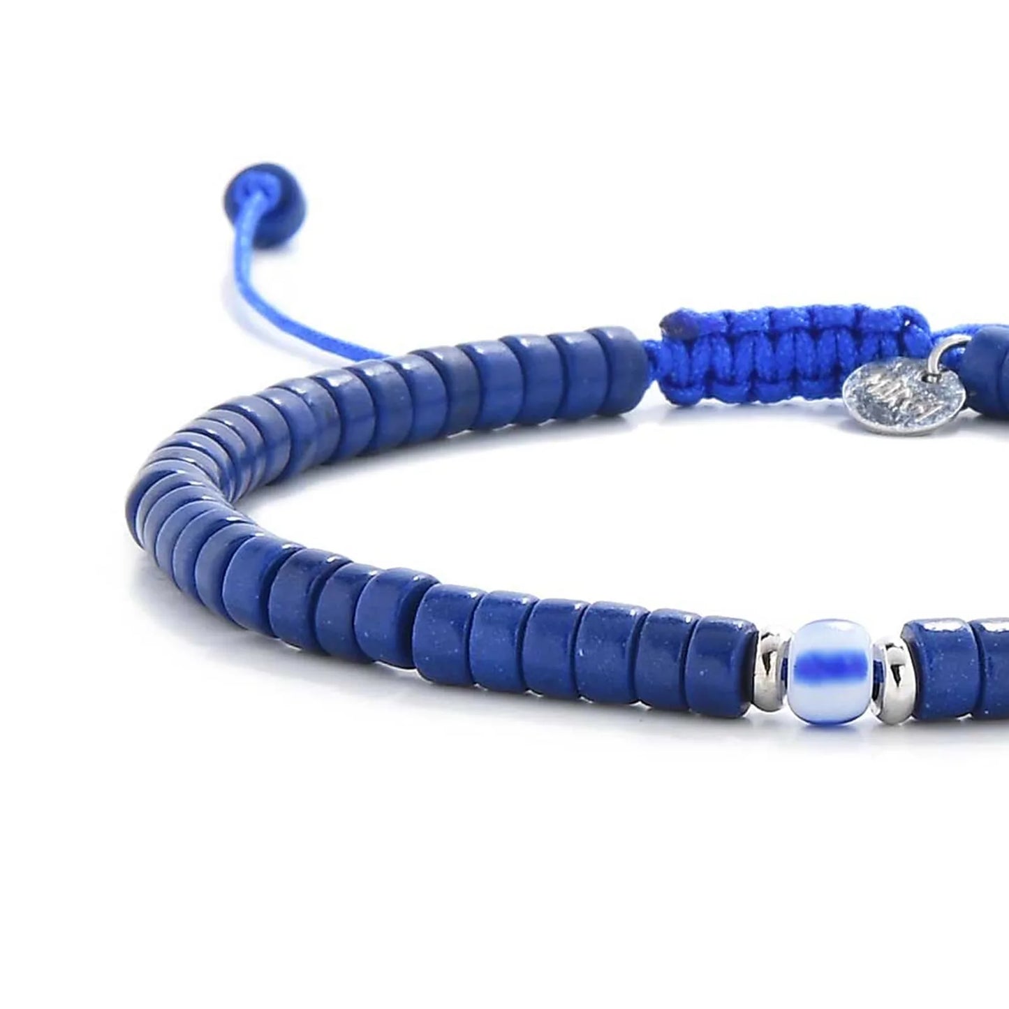 Close-up of Blue Gemstone Jewelry showing blue clay beads with blue accent bead, silver charm, and cord closure