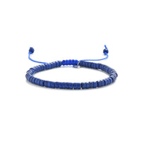 Blue Stone Bracelet shown in full view with blue clay beads with silver charm and adjustable cord