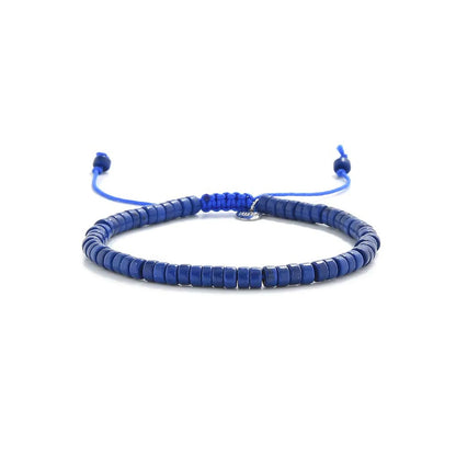 Blue Stone Bracelet shown in full view with blue clay beads with silver charm and adjustable cord
