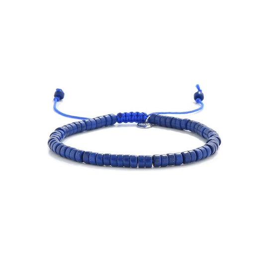Blue Stone Bracelet shown in full view with blue clay beads with silver charm and adjustable cord