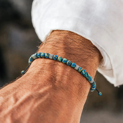 Bracelet Malachite worn on wrist showing blue patterned beads and silver accent spacers