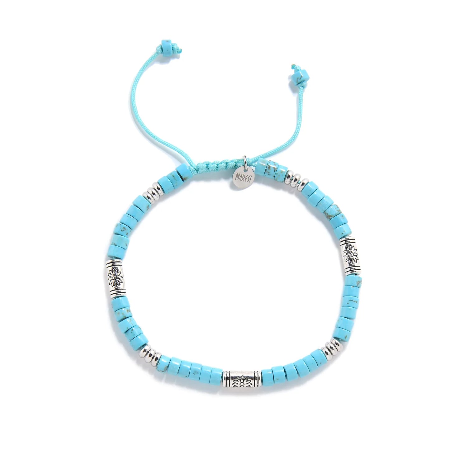 Bracelet of Clay shown from above with turquoise clay beads with engraved silver spacers and round bracelet shape