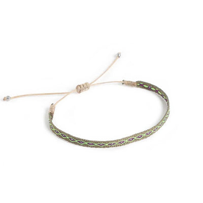 Braided Bracelet shown from above with olive patterned band and sliding knot cord closure