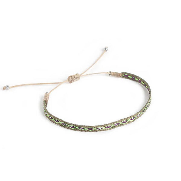 Braided Bracelet shown from above with olive patterned band and sliding knot cord closure
