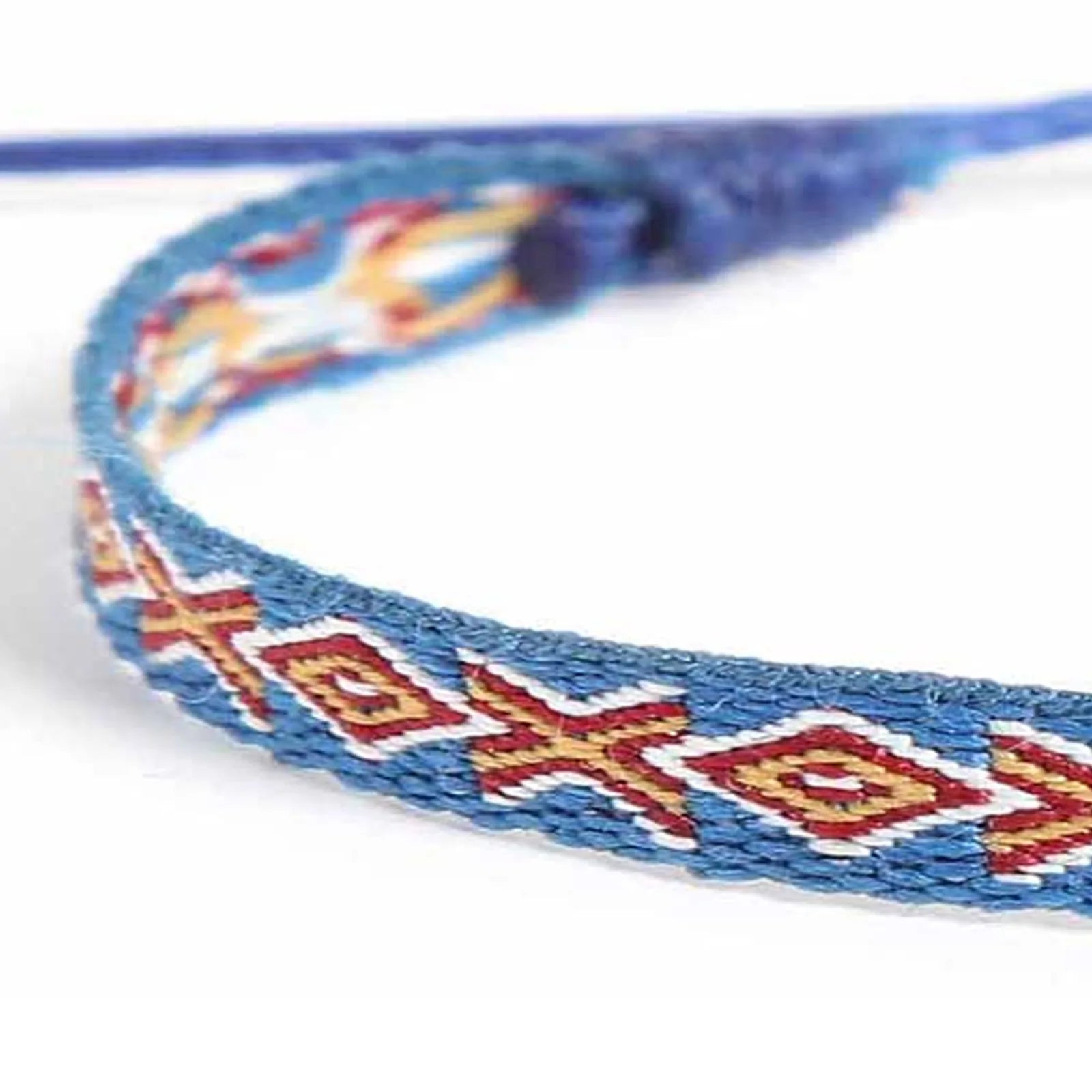 Detailed view of Braided Bracelets texture with blue cord, red diamond pattern, and cream accents