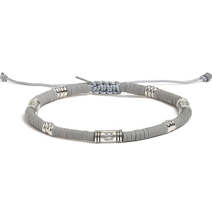 Front view of CANUS shamballa bracelet featuring gray clay beads and silver engraved spacers

