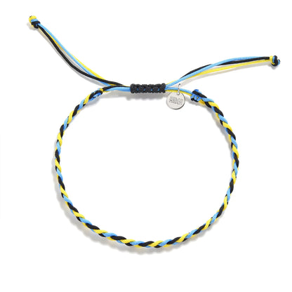 Overhead view of the Carbini string bracelet with blue, yellow, and black cords, adjustable knot, and Maresi tag