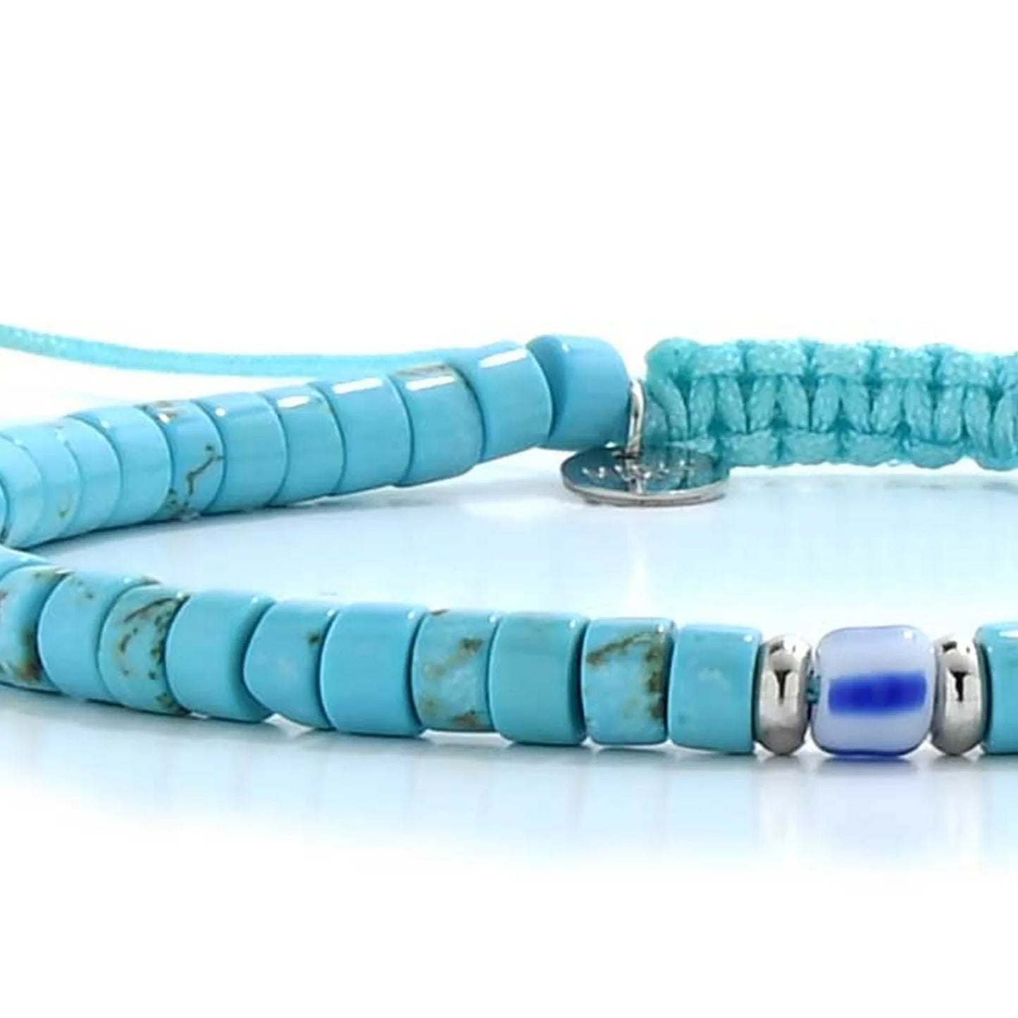 Detailed view of Clay Beads for Bracelets with turquoise clay beads with blue accent bead, Santorini clay bead texture, and