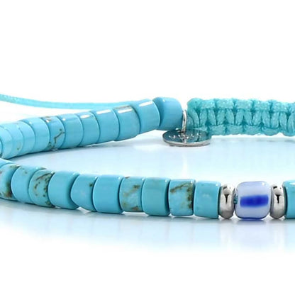 Detailed view of Clay Beads for Bracelets with turquoise clay beads with blue accent bead, Santorini clay bead texture, and
