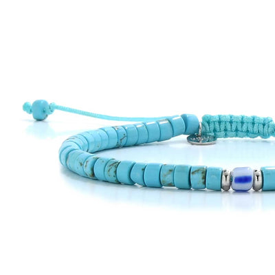 Close-up of Clay Beads for Bracelets showing turquoise clay beads with blue accent bead, silver charm, and cord closure