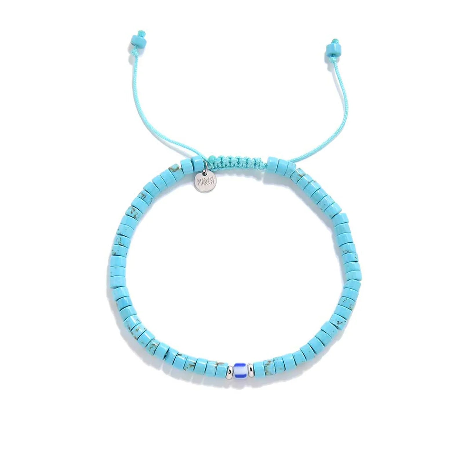 Clay Beads for Bracelets shown from above with turquoise clay beads with blue accent bead and round bracelet shape