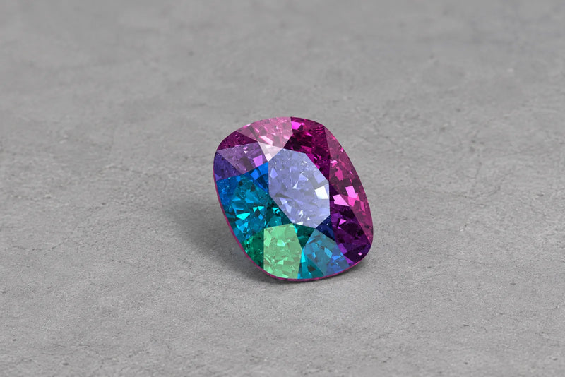 Stylized cushion-cut gemstone illustration with purple, blue, and green facets