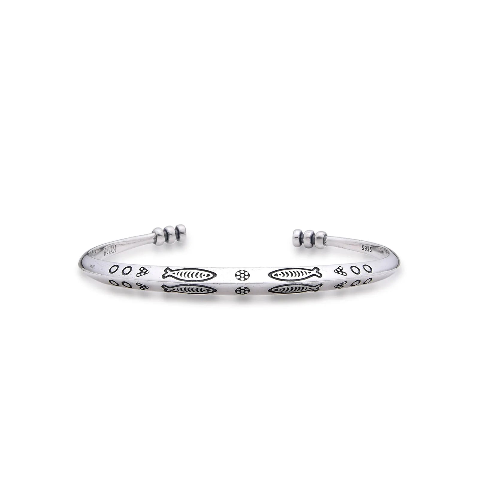 Cuff Bracelet with polished silver tone band, fish engravings, dotted details, and open ends