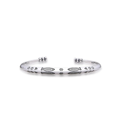 Cuff Bracelet with polished silver tone band, fish engravings, dotted details, and open ends
