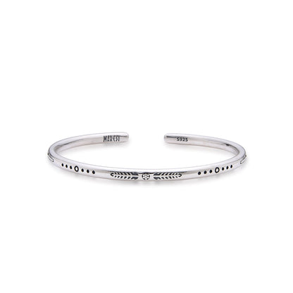 Full front-facing image of NOSTRAS engraved cuff bracelet