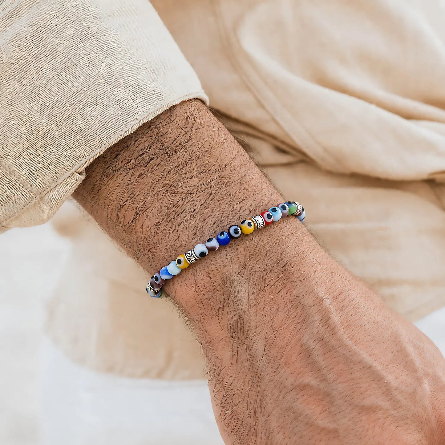 Evil Eye Bracelet for Men worn on a wrist with a light sleeve