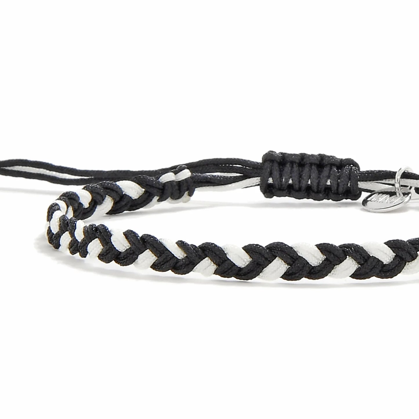 Friendship Woven Bracelet close-up of braided black and white cord and sliding knot