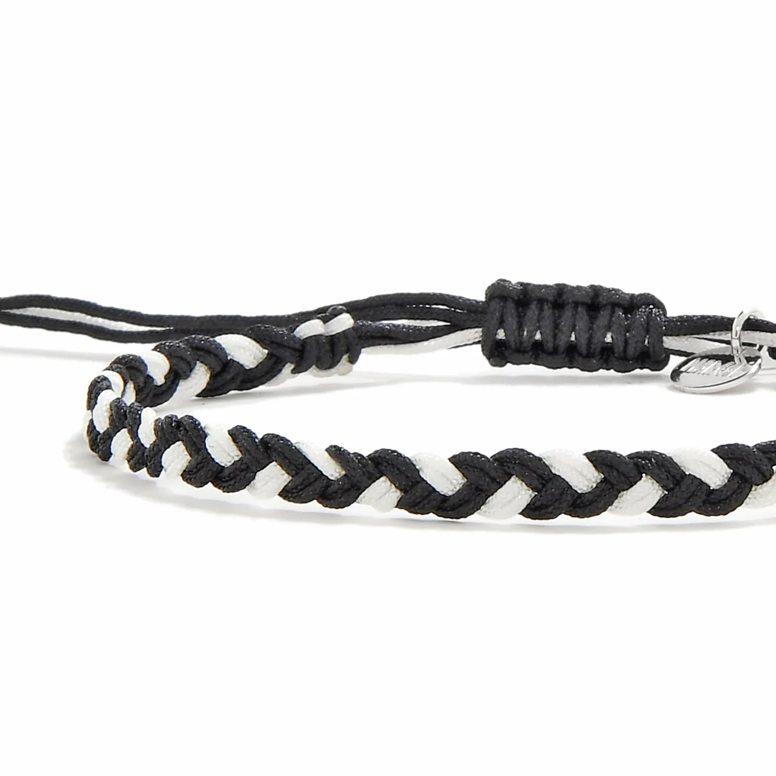 Friendship Woven Bracelet close-up of braided black and white cord and sliding knot