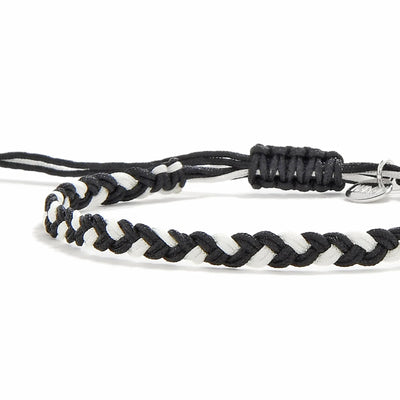 Friendship Woven Bracelet close-up of braided black and white cord and sliding knot