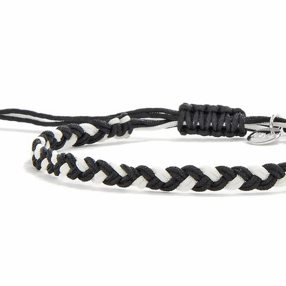 Friendship Woven Bracelet close-up of braided black and white cord and sliding knot
