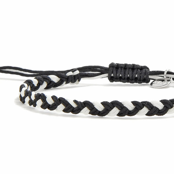Friendship Woven Bracelet close-up of braided black and white cord and sliding knot