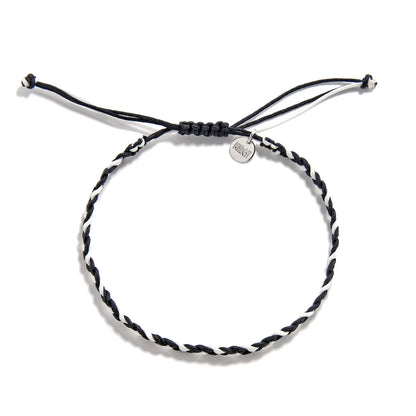 Friendship Woven Bracelet flat lay showing round woven cord and Maresi charm tag