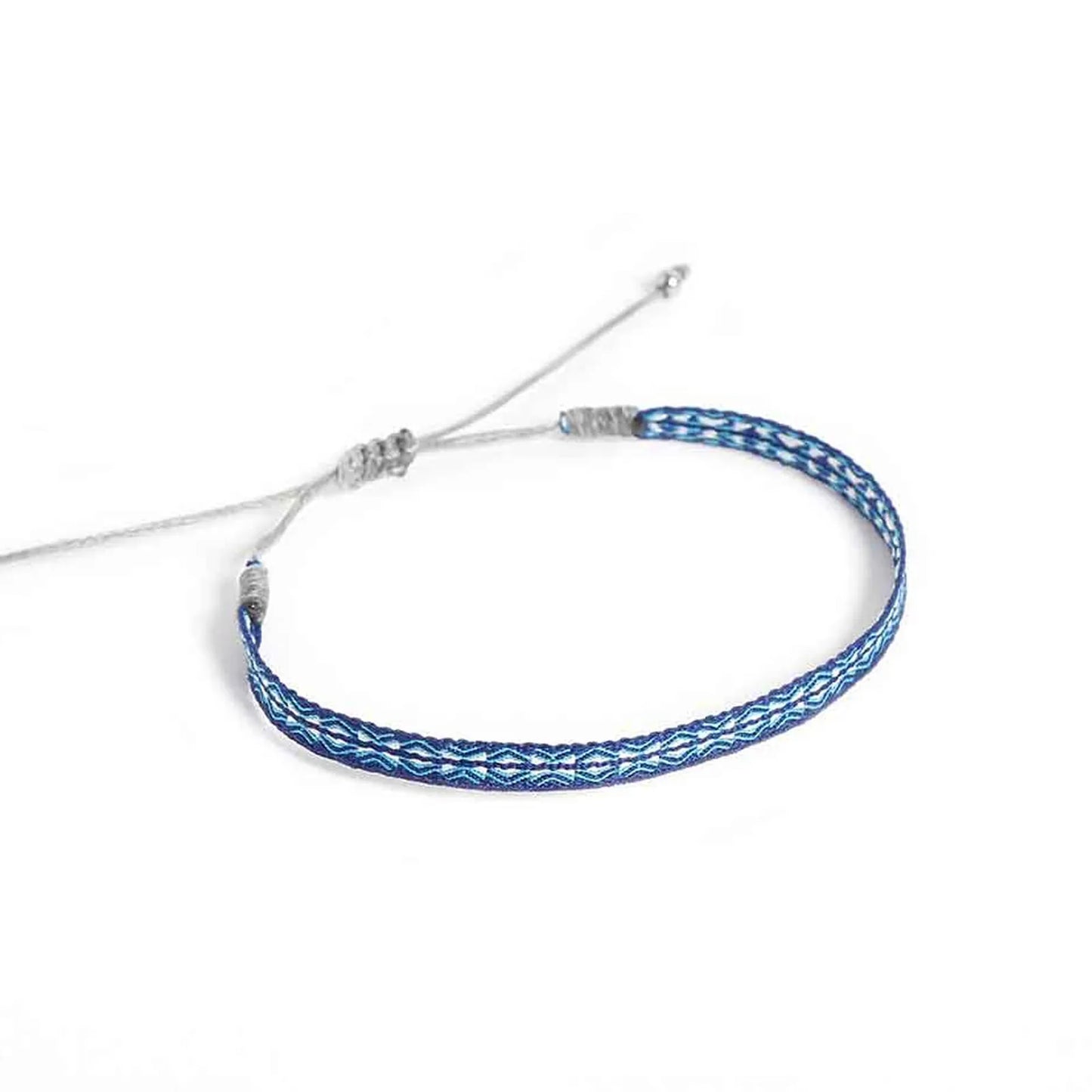Handmade Bracelet shown from above with blue patterned band and gray sliding knot cord closure
