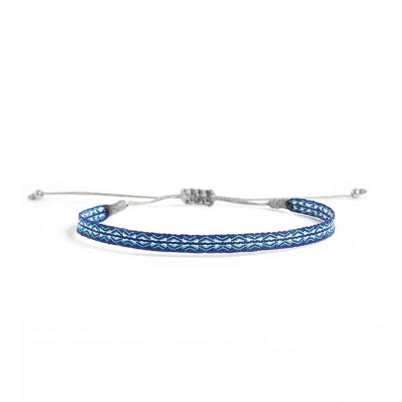 Handmade Bracelet in blue with turquoise and white woven pattern, gray cord, and silver bead ends