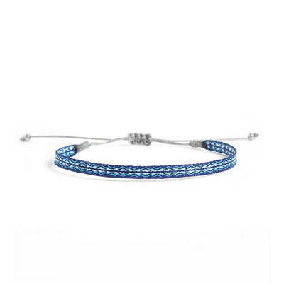 Handmade Bracelet in blue with turquoise and white woven pattern, gray cord, and silver bead ends