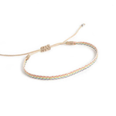 Handmade Bracelets shown from above with white rainbow band and sliding knot cord closure
