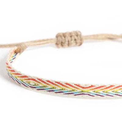Close-up of Handmade Bracelets with white woven band and rainbow chevron stitching