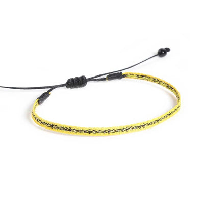 Handmade Mens Bracelets shown from above with yellow patterned band and black sliding knot closure