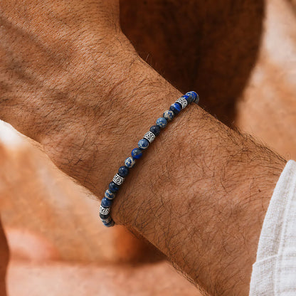 Jasper Bracelet worn on a wrist with beaded design and adjustable cord