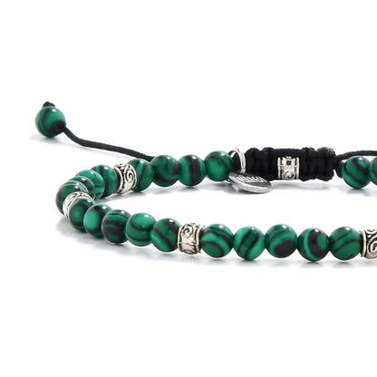 Malachite  bracelet close up with stone beads and metal accents