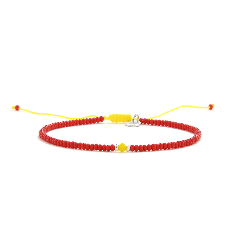 Man Bracelet Beads shown in full view with red seed beads with yellow accent beads and adjustable cord