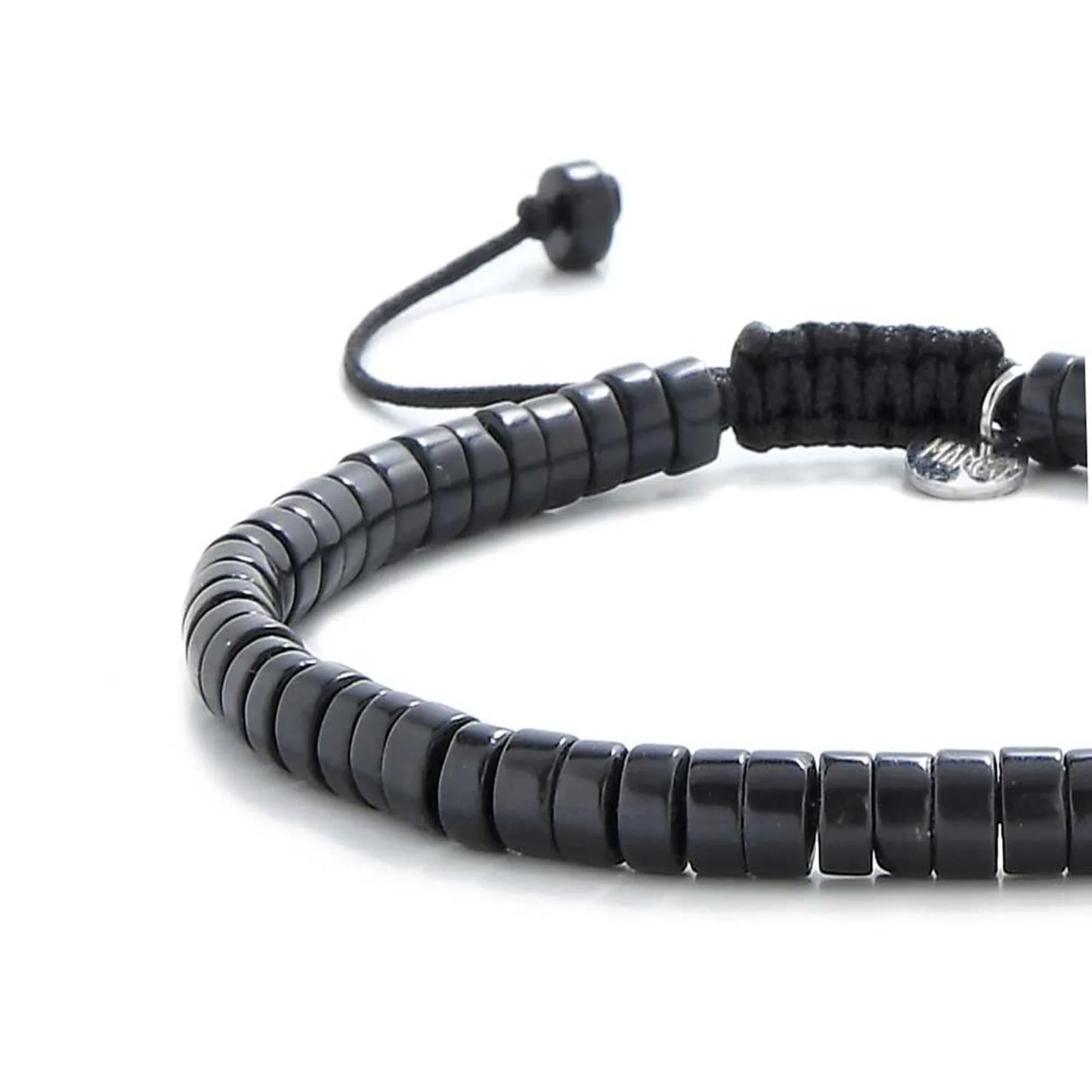 Close-up of matte black bracelet showing matte black clay beads with silver charm, silver charm, and cord closure