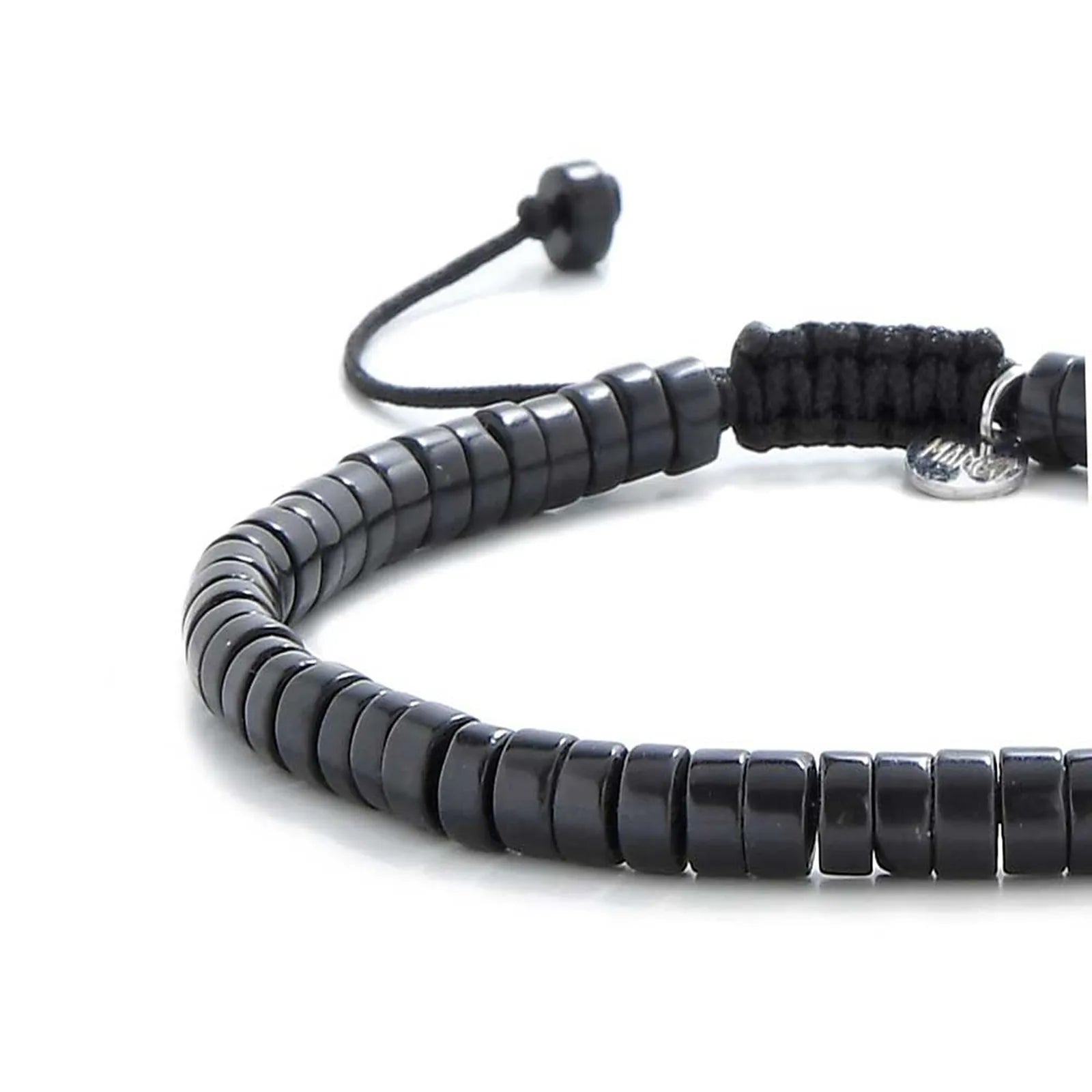 Close-up of matte black bracelet showing matte black clay beads with silver charm, silver charm, and cord closure