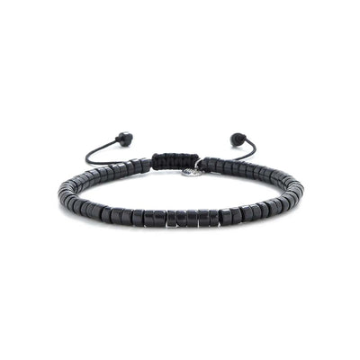matte black bracelet shown in full view with matte black clay beads with silver charm and adjustable cord