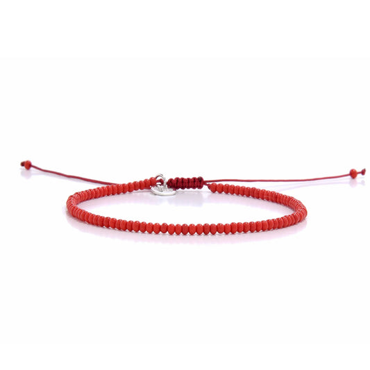 Men Beaded Bracelets shown in full view with red seed beads with silver charm and adjustable cord