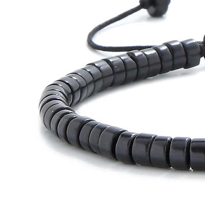 Close-up of MAVROS Clay men black bracelet showing smooth black beads