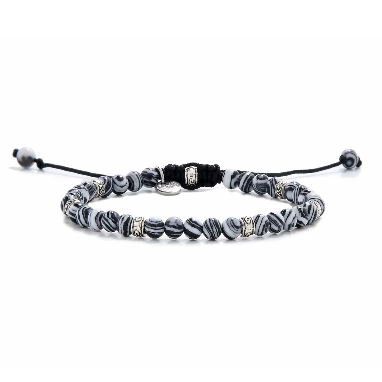 Full view of men’s malachite bracelet featuring striped black and white beads with silver spacers.