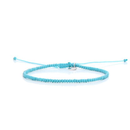 Mens Beaded Bracelets shown in full view with turquoise seed beads with silver charm and adjustable cord