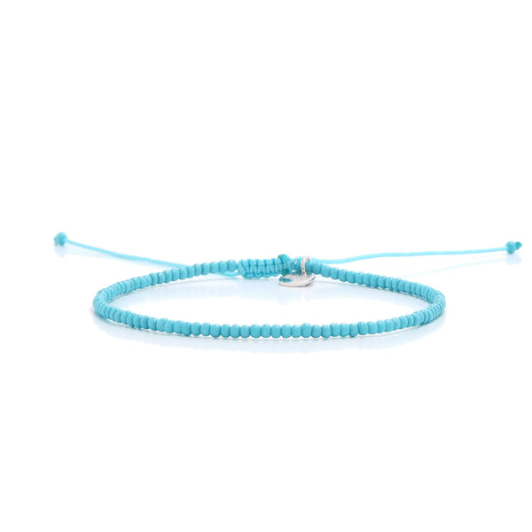 Mens Beaded Bracelets shown in full view with turquoise seed beads with silver charm and adjustable cord