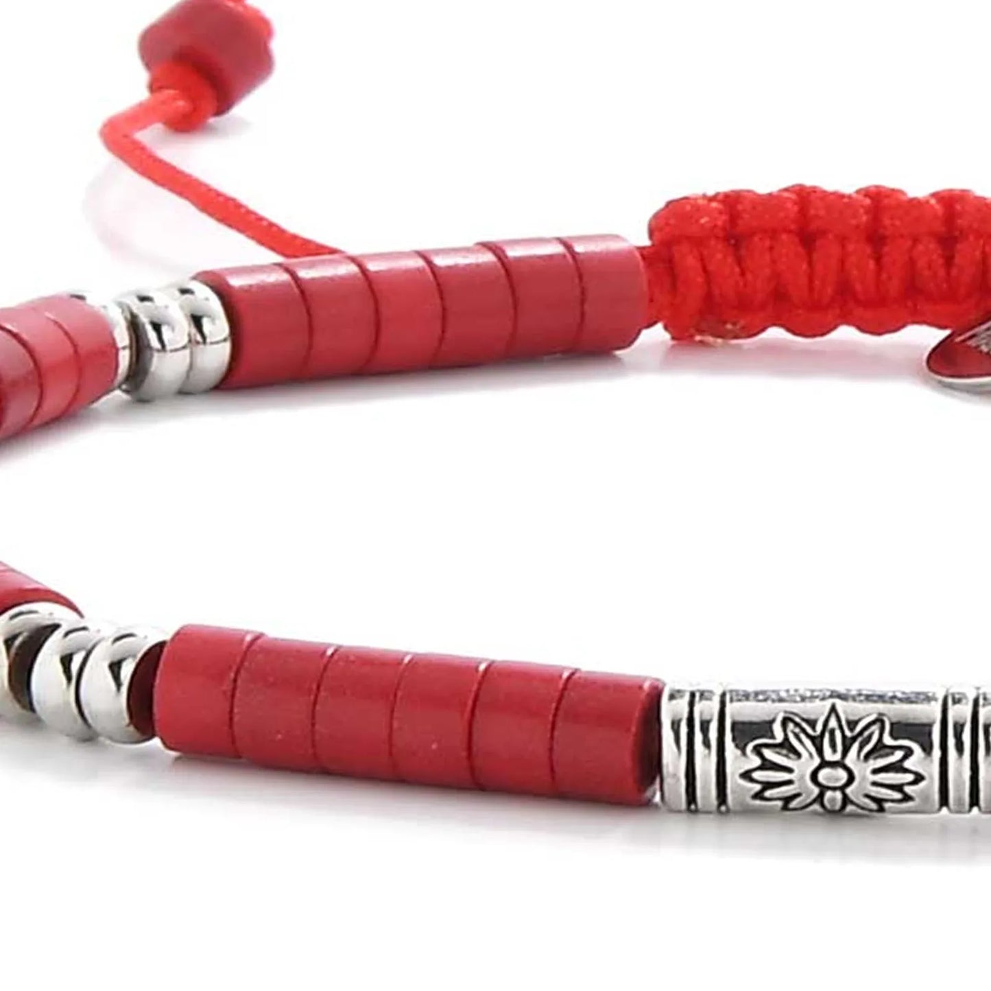 Detailed view of mens red bracelet with red clay beads with engraved silver spacers, Shamballa clay bead texture, and cord